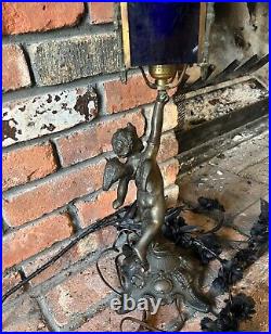 Antique Metal Art Deco Winged Cherub Table Light with Plastic Blue Shades