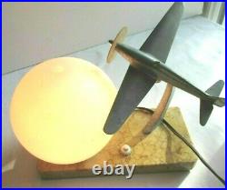 Art Deco table lamp, Aluminum airplane and tulip ball on marble terrace