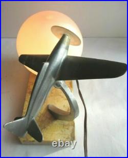 Art Deco table lamp, Aluminum airplane and tulip ball on marble terrace